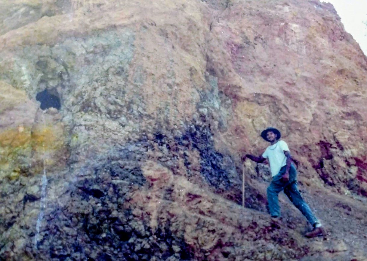 Young geochemist on a copper mine face, Cyprus, early 1980s
